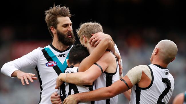 Justin Westhoff, left, celebrates a goal with Todd Marshall, Lindsay Thomas and Sam Powell-Pepper. Picture: Adam Trafford/AFL Media/Getty Images