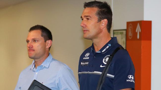 Crows list manager Justin Reid with his Carlton counterpart Stephen Silvagni. Picture: Scott Barbour/Getty Images