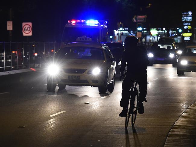 Cyclist screaming down the road at around 30-40 km/h when the traffic lights were red.