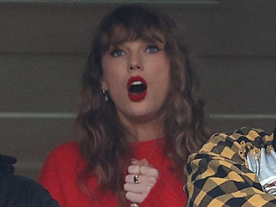 BALTIMORE, MARYLAND - JANUARY 28: Taylor Swift and Ross Travis look on during the second quarter in the AFC Championship Game between the Baltimore Ravens and the Kansas City Chiefs at M&T Bank Stadium on January 28, 2024 in Baltimore, Maryland. (Photo by Rob Carr/Getty Images)