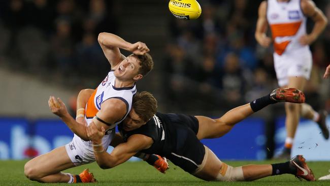 Patrick Cripps nabs Jacob Hopper.