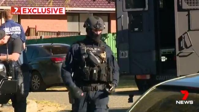 Police wearing bullet proof vests were also on site dealing with the operation. Picture: 7News