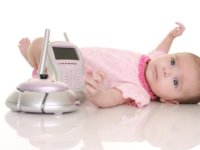 baby with baby monitor as a safety concept.  ipad generic