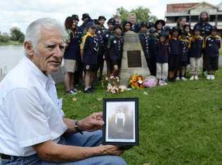 The Scouts own 70th anniversary service commemoration of the drowning of 13 cubs on the Clarence River at Graftons Memoial Park on Sunday. Younger brother of the oldest boy who drowned Barry Wilkes holds onto a photo of his brother Bobby then aged 10 at the time of the accident. Photo Debrah Novak / The Daily Examiner. Picture: Debrah Novak