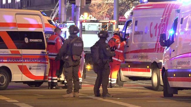 Special forces stand guard among ambulance workers at the scene of an attack in Magdeburg, eastern Germany. Picture: NEWS5 / AFP