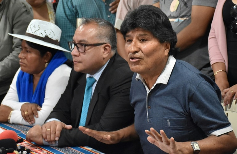 Ex-president of Bolivia says 14 shots fired at his car