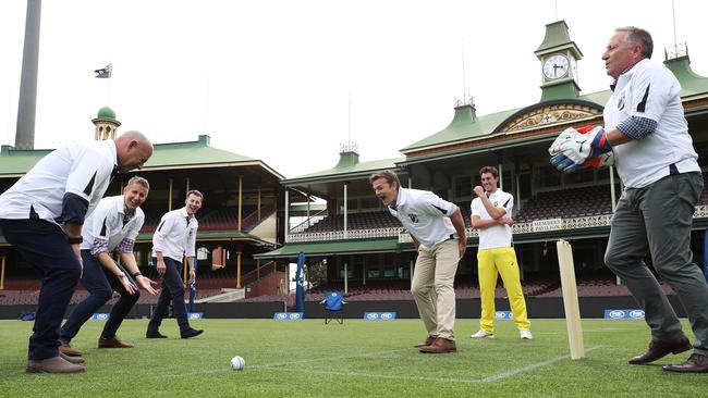 Darren Lehmann gets hit below the belt from Adam Gilchrist at the SCG to launch FOX CRICKET on Foxtel. Picture: Brett Costello