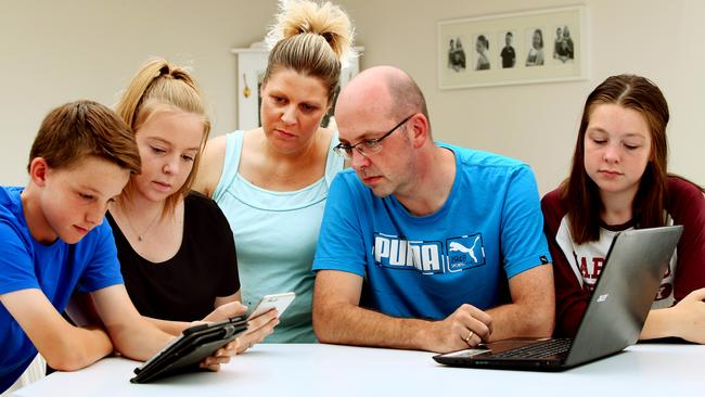 Neil and Leanne Dallimore, with children Andrew, 12, Chloe, 17 and Abbey, 14, from Blue Haven, are disappointed with the speed of their $120 per month NBN broadband internet package. Picture:Peter Clark