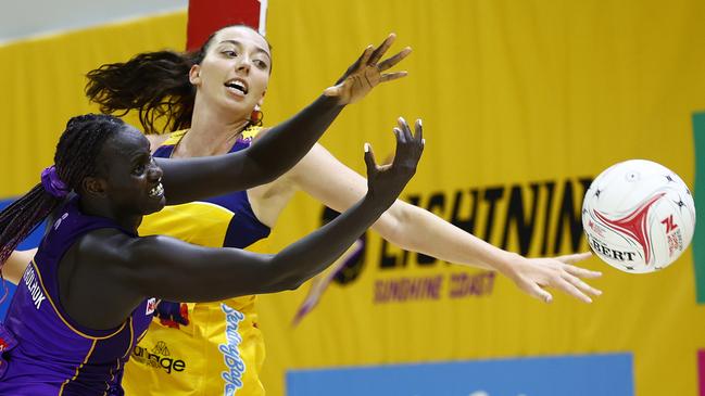 SUNSHINE COAST, AUSTRALIA - APRIL 26: Mary Cholhok of the Firebirds and Ashleigh Ervin of the Lightning compete for the ball during the round three Super Netball match between Sunshine Coast Lightning and Queensland Firebirds at UniSC Arena, on April 26, 2025, in Sunshine Coast, Australia. (Photo by Russell Freeman/Getty Images)