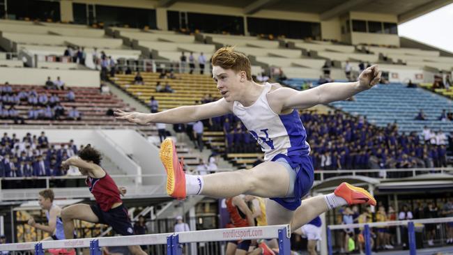 Nudgee College prop Billy Campbell flying in the hurdles event during the 2023 GPS Track and Field Championships. He will wear jersey No. 1 on Sunday.