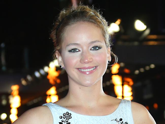 Actress Jennifer Lawrence poses for photographers upon arrival to the world premiere of the film The Hunger Games Mockingjay Part 1 in London, Monday, Nov. 10, 2014. (Photo by Joel Ryan/Invision/AP)