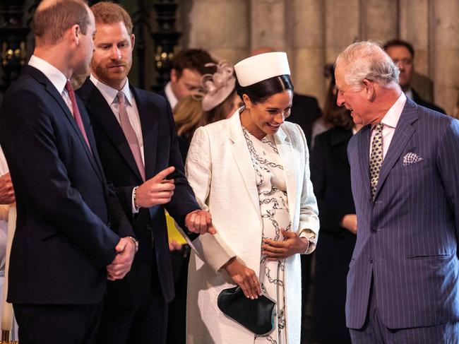 The royal couple with Prince William and Prince Charles. Picture: AFP 