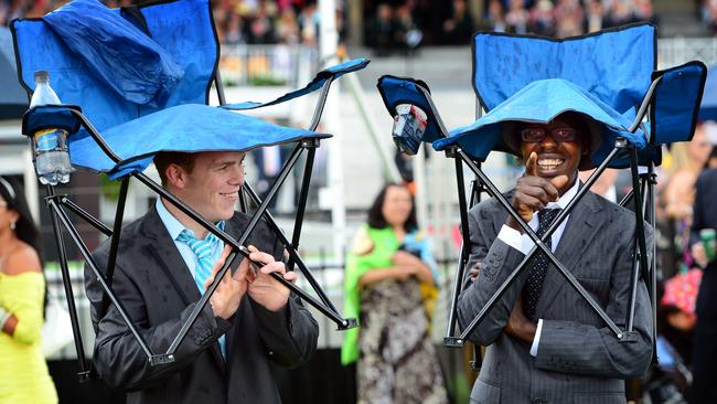 Chairs: the unexpected race day essential for rain protection. Picture: Alex Coppel