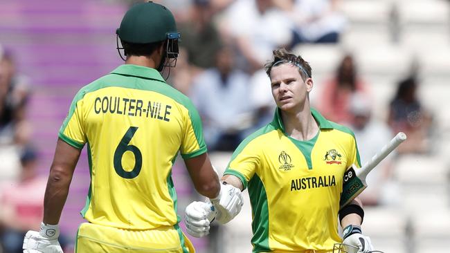 Steve Smith is congratulated by teammate Nathan Coulter-Nile after reaching his century. Picture: AP