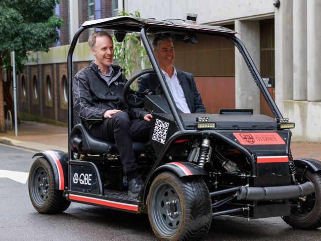 Australian Centre for Robotics senior researcher Stewart Worrall and Roads Minister John Graham during a driverless vehicle trial in Chippendale. Picture: Justin Lloyd.