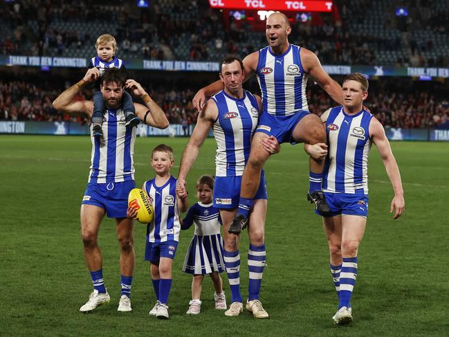 Cunnington being chaired off after his final game. Photo by Michael Klein.