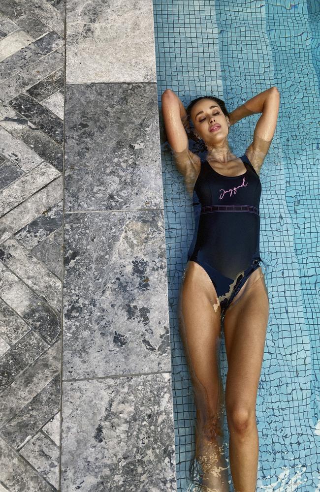 She posed poolside in her backyard wearing the Vista Del Mar one-piece ($109.95). Picture: Jaggad