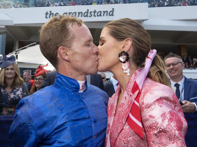 Kerrin McEvoy gets a kiss from wife Cathy after the presentation of the Melbourne Cup. Picture Jay Town