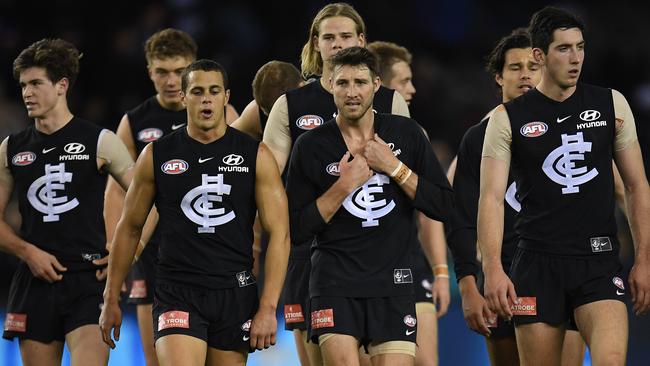 Carlton players make their way from the ground after another loss. Picture: AAP