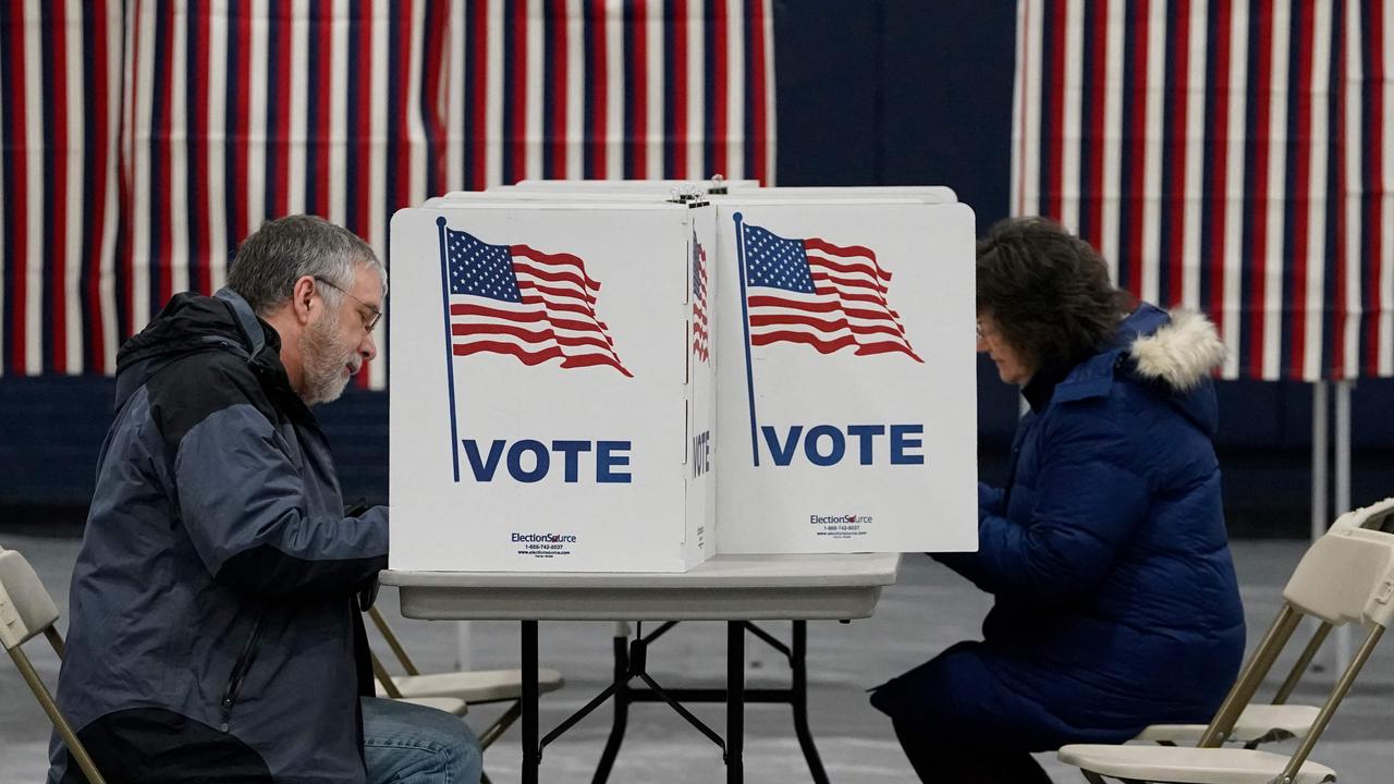 New Hampshire residents cast their ballots in the state's primary on January 23, 2024, in Concord. (Photo by TIMOTHY A. CLARY / AFP)