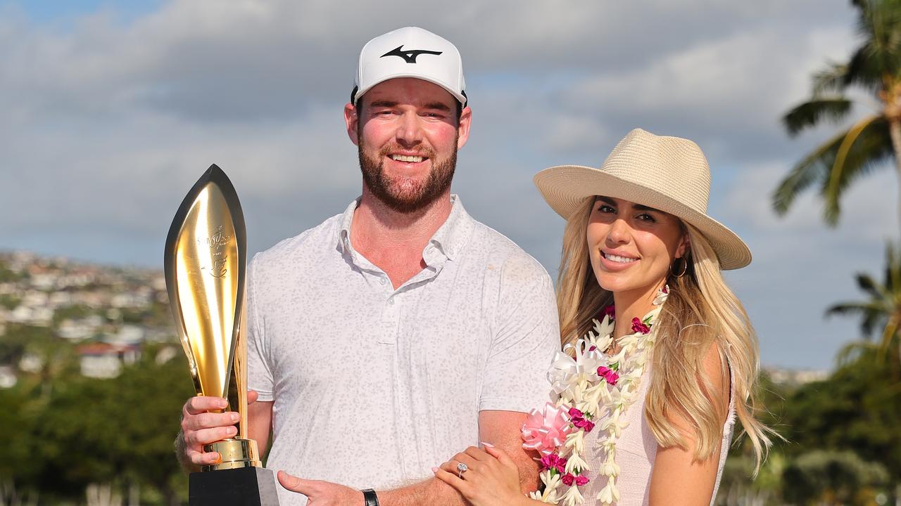 Grayson Murray and fiancee, Christiana after his win in Hawaii at Waialae Country Club. (Photo by Michael Reaves/Getty Images)