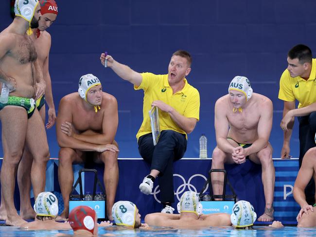 PARIS, FRANCE - JULY 28: Tim Hamill, Head Coach of Team Australia, gives the team instructions during the Men's Water Polo Preliminary Round - Group B match between Team Australia and Team Spain on day two of the Olympic Games Paris 2024 at Aquatics Centre on July 28, 2024 in Paris, France. (Photo by Clive Rose/Getty Images)