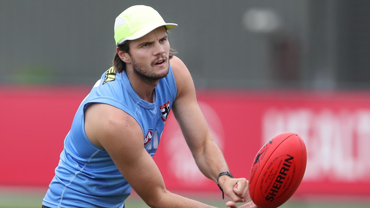 Hunter Clark dishes a handball. Picture: David Crosling