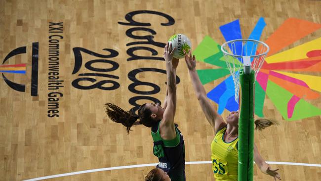 Caitlin Thwaites of Australia blocks a shot by Fionnuala Toner of Northern Ireland. Photo: AAP