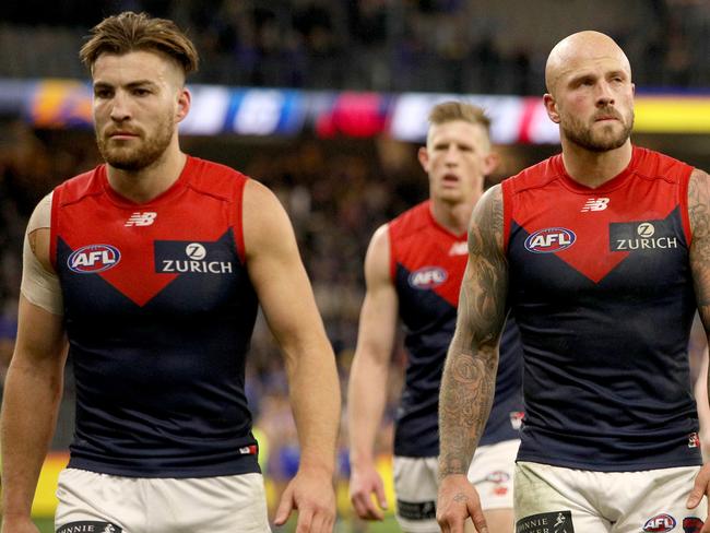 Demons players leave the field after their loss during the Round 9 AFL match between the West Coast Eagles and the Melbourne Demons at Optus Stadium in Perth, Friday, May 17, 2019.  (AAP Image/Richard Wainwright) NO ARCHIVING, EDITORIAL USE ONLY