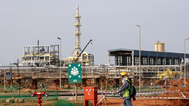 FILE - In this Thursday, April 19, 2012 file photo, a worker walks at the site of Lynas rare earths plant under construction in Gebeng, eastern Malaysia. Australian miner Lynas Corp. said Wednesday, Sept. 5, 2012 it has secured the Malaysian government's approval to fire up a controversial rare earths plant. (AP Photo/Lai Seng Sin, File)