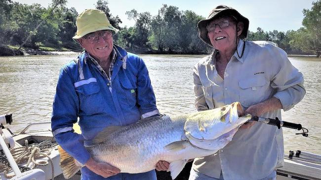 Terry Howard and Jim Motlock with a beautiful barra caught on the Daly River - successfully released.