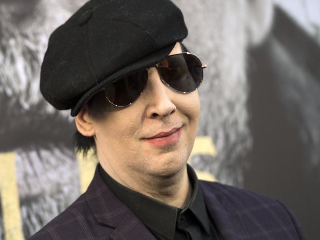 (FILES) This file photo taken on May 8, 2017 shows Singer/musician Marilyn Manson attending the world premiere of "Arthur: Legend of the Sword" at the TCL Chinese Theatre in Hollywood, California. Shock rocker Marilyn Manson was hospitalized on September 30, 2017 after he was crushed by a falling stage prop during a concert in New York. / AFP PHOTO / VALERIE MACON