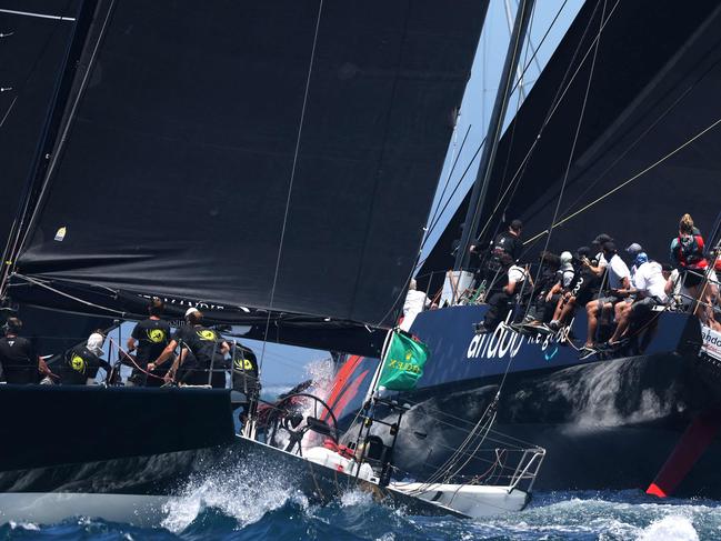 Yachts Moneypenny (L) and Andoo Comanche compete at the start of the Sydney to Hobart yacht race on December 26, 2022 on Sydney Harbour. (Photo by DAVID GRAY / AFP) / -- IMAGE RESTRICTED TO EDITORIAL USE - STRICTLY NO COMMERCIAL USE --