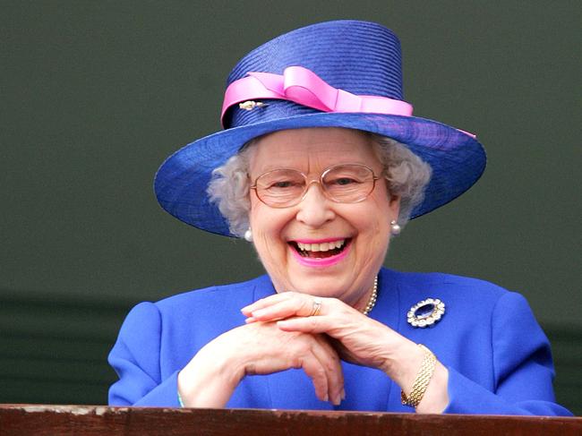 (FILES) In this file photo taken on June 2, 2007 Queen Elizabeth II watches as Jockey Frankie Detorri crosses the finish line to win the Vodafone Derby with Irish horse Authorized on the second day of the annual Vodafone Derby horse race at Epsom Downs, Surrey. - Queen Elizabeth II, the longest-serving monarch in British history and an icon instantly recognisable to billions of people around the world, has died aged 96, Buckingham Palace said on September 8, 2022. Her eldest son, Charles, 73, succeeds as king immediately, according to centuries of protocol, beginning a new, less certain chapter for the royal family after the queen's record-breaking 70-year reign. (Photo by Carl DE SOUZA / AFP)