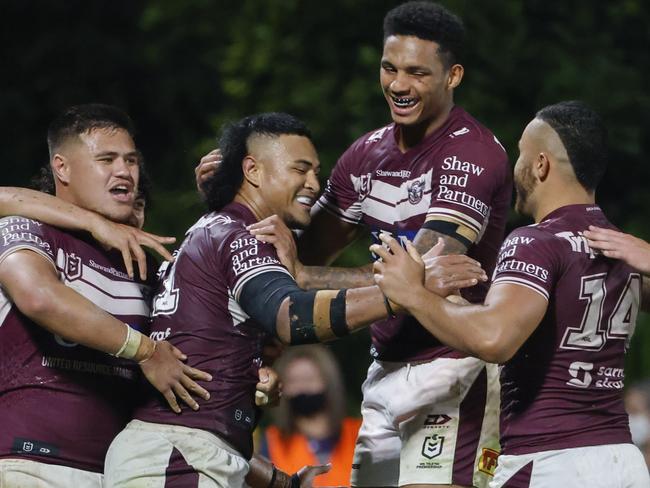 SUNSHINE COAST, AUSTRALIA - AUGUST 14: Haumole Olakau'atu of the Sea Eagles celebrates with his teammates after scoring a try during the round 22 NRL match between the Manly Sea Eagles and the Parramatta Eels at Sunshine Coast Stadium, on August 14, 2021, in Sunshine Coast, Australia. (Photo by Glenn Hunt/Getty Images)