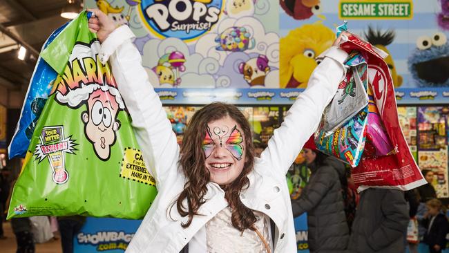 Ruby, 9, collects her showbags at the pavilion at the Royal Adelaide Show. Picture: Matt Loxton