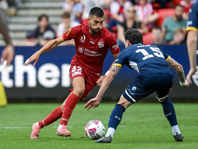 Austin Ayoubi looks for a way past Storm Roux. Picture: Getty Images