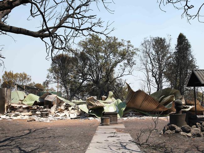 Charred corrugated iron is all that remains of this property. Picture: Peter Lorimer.