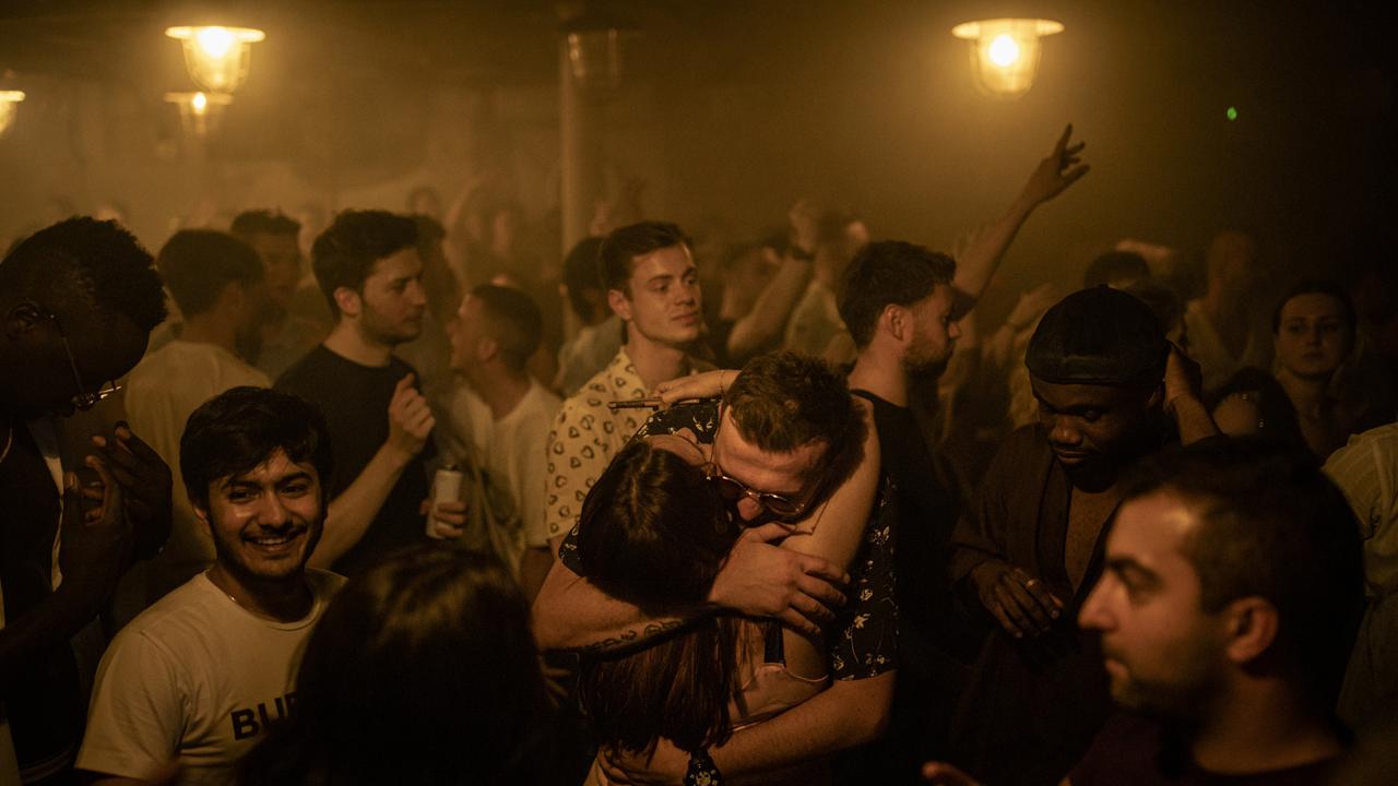 Two people hug in the middle of the dancefloor at Egg London nightclub in the early hours of Freedom Day in England. Picture: Getty Images