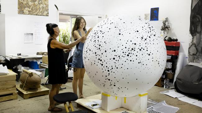 Lindy Lee with assistant Zoe Wesolowski at her studio in Byron Bay. Picture: Justine Walpole