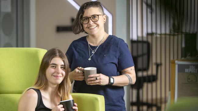 Accenture integration architecture analyst Lauren Springer (L) and application development analyst Bella Santiago (R) at the Adelaide Hub in Kent Town. Picture Emma Brasier.