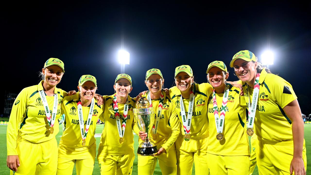 Ashleigh Gardner (left) celebrates Australia’s 2022 ODI World Cup win with teammates. Picture: Getty Images