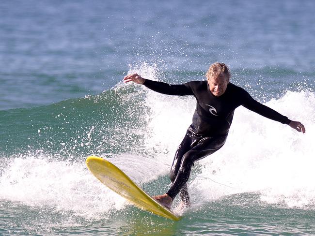 Midget Farrelly surfing at Dee Why Beach in 2014 to celebrate the 50th anniversary of the first world championship crown. Picture; David Swift