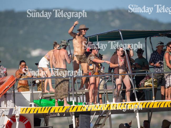 Sam Burgess celebrates with mates on the boat. Picture: Backgrid