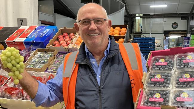 Melbourne Cup winning owner Noel Greenhalgh, selling fruit at the Brisbane Markets on Thursday morning, has four runners in Saturday’s Group 1 Turnbull Stakes. Picture: Ben Dorries