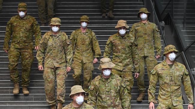 Members of the Australian Defence Force walk through Melbourne. Picture: Quinn Rooney/Getty Images