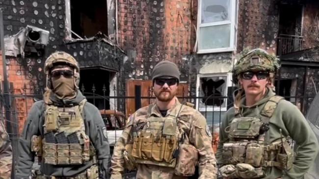 Felix Metrikas, right, with members of the Ukrainian National Guard at Hostomel in the country's north.