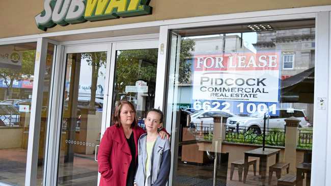 DEVASTATED: Kellie Acton said she and husband Andrew were "gutted" to have to close their Subway Restaurant on Molesworth St, in Lismore. She is pictured with daughter Mardhi. Picture: Francis Witsenhuysen