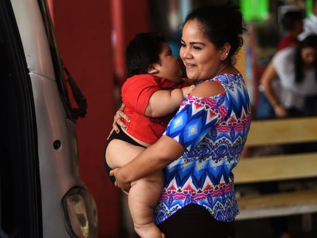 Isabel Pantoja is exhausted from carrying her son Luis Gonzales, who weighs 28 kilos. Picture: AFP