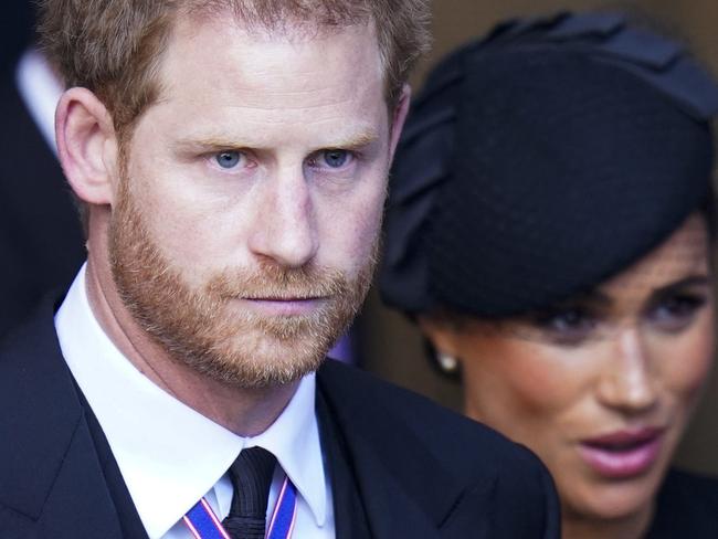 Britain's Prince Harry, Duke of Sussex and Meghan, Duchess of Sussex leave after a service for the reception of Queen Elizabeth II's coffin at Westminster Hall, in the Palace of Westminster in London on September 14, 2022, where the coffin will Lie in State. - Queen Elizabeth II will lie in state in Westminster Hall inside the Palace of Westminster, from Wednesday until a few hours before her funeral on Monday, with huge queues expected to file past her coffin to pay their respects. (Photo by Danny Lawson / POOL / AFP)